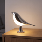 Lampe Oiseau argentée allumée