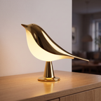 Lampe Oiseau dorée allumée